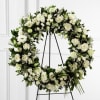 Wreath with white &amp; greens. Shown is deluxe pricing. 
