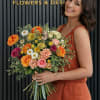 A warm and vibrant garden-style bouquet inspired by rich autumn tones and