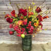 WILD ASSORTMENT OF SENSUAL COLORS OF FORSITIA BRANCHES, MANGO CALLA LILIES, YELLOW