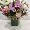 Medium high floral arrangement compose of an assortment of Jules Elie peonies