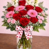 A gorgeous arrangement with roses, gerbera daisies, snap dragons, carnations, eucalyptus and