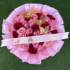 36 long-stemmed pink roses, wrapped in pink paper with butterflies, and a