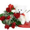 A romantic bouquet of six premium red roses with baby's breath and