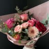 Our signature wrapped bouquet in festive Valentine's Day colors available in 3