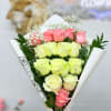 Elegant bouquet of fresh pink and white roses, beautifully arranged to convey