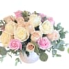 Cream, blush and soft pink roses accented with sage green eucalyptus in