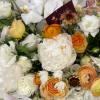 Floral arrangement focusing on whites and creams with touches of seasonal fall