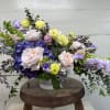 The Designer's Choice Compote Arrangement is an artistic and elegant arrangement of