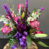 Purple flowers arranged intricately for the lover of purple.  Pops of