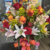  A lovely arrangement filled with colorful roses, calalilies, stock and filler.
