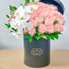 The "A Pinch of Love" Bouquet featuring white orchids and light pink