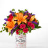 This bright and cheerful combo of roses, lilies, stock and more is