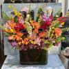 This arrangement is a bold, joyful celebration of color and texture. 

A