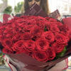 Elegantly packaged long red roses.
