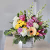 Pink roses and yellow daisies in a square box