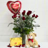 Celebrate love and elegance with 12 long-stem red roses--artfully arranged in a