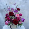This high end, stylized arrangement is a modern expression of romance, designed