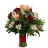 An elegant bouquet of 12 red and pink roses, accompanied by decorative