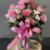 A beautiful arrangement with pink roses and a special Happy Birthday pick.