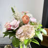 An elegant arrangement full of beautiful blush tones that would be a
