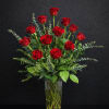 Twelve premium long-stem red roses, beautifully arranged with fresh greenery in a