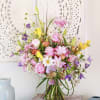 Experience the enchanting allure of our "Blossom Bliss" arrangement, a celebration of