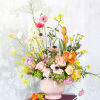Brighten your space with our enchanting Whimsical Floral arrangement, featuring a delightful