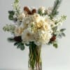 A snowy celebration of white blooms and pinecones, bringing elegance to every