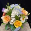 This 'sweet' bouquet in a pure white ceramic vase is exactly that