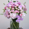 This exquisite flower bouquet in rich shades of pink showcases a captivating