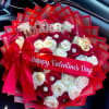 An extravagant mix of red and white roses adorned with elegant details