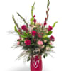 Passionate Love is a bold, romantic arrangement featuring rich red blooms, soft