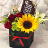 Black Gift Box of Sunflowers, Lilies, Roses, Cushion Pom with Solidago Accents.