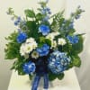Deluxe blue Hydrangea, blue &amp; white Carnations, white Daisies and blue Delphinium.