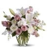 Gorgeous, gorgeous, gorgeous! This lush natural arrangement of royal roses, lilies, lisianthus