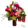 Elegant arrangement of fresh roses and mixed flowers presented in a clear