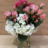 This sweet arrangement of soft pinks and whites is a precious gift