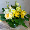 hydrangea, roses, lisianthus and cymbidium orchid in shades of yellow and white