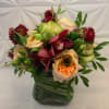 garden roses, orchid, vegetable roses, hypericum berries and straw flower.  In
