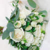 All white hand tied flowers ready arranged and gift wrapped for you