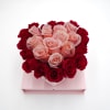 A heart-shaped arrangement of Pink and Hot Pink roses in a cube