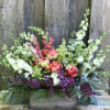 A mix of the freshest seasonal flowers in cheerful colors gathered in