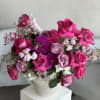 A striking luxury arrangement designed in a beautiful ceramic vase, featuring a