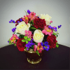 A velvety mix of white roses, burgundy carnations, and pink alstroemeria is