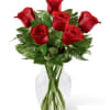 Long stem red roses, monte casino, and glass vase.