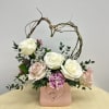 Evoking the playful spirit of Cupid, this enchanting arrangement captures the essence