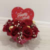 A romantic Valentine&rsquo;s arrangement featuring fresh red roses beautifully arranged in a