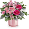 This Valentine's Day arrangement showcases hot pink roses, pink spray roses, pink