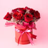 At the center is a lush bouquet of ONE dozen red roses
