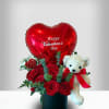A romantic arrangement featuring a heart‑shaped &ldquo;Happy Valentine&rsquo;s Day&rdquo; balloon, fresh red